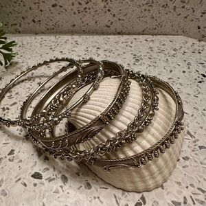 6 pc silver tone textured bangle set.